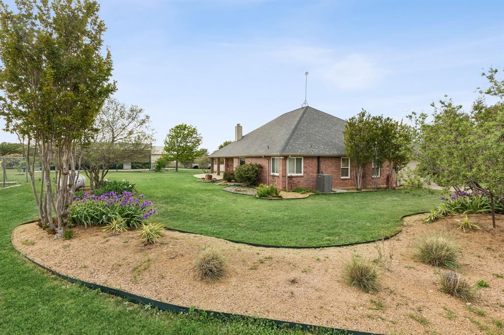 1901 Saw Tooth Court Haslet, TX 76052 - Photo 33 of 38 a house with green field in front of it