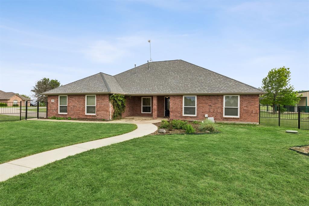 1901 Saw Tooth Court Haslet, TX 76052 - Photo 34 of 38 a view of a house with a backyard