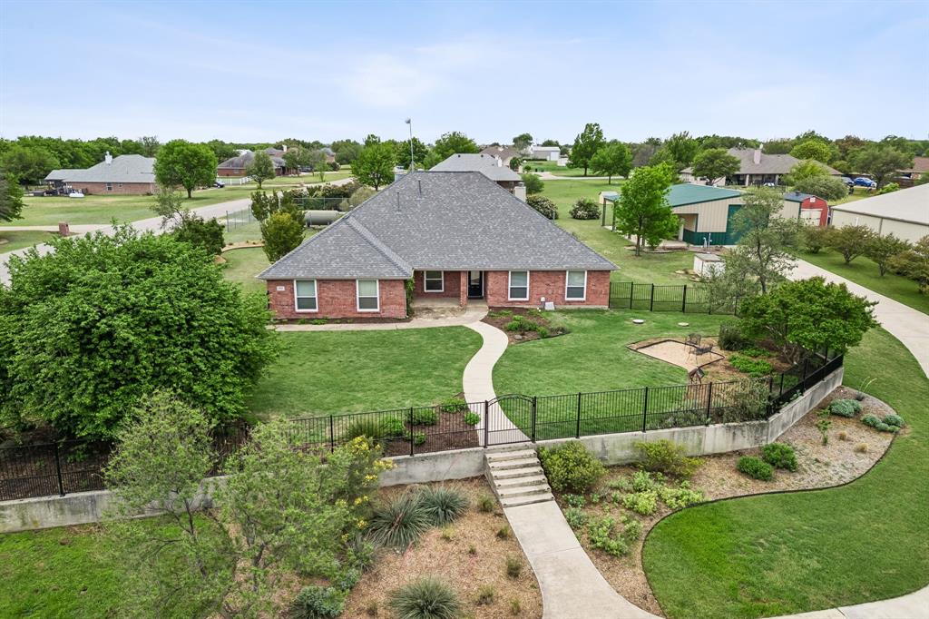 1901 Saw Tooth Court Haslet, TX 76052 - Photo 4 of 38 a view of a garden with a patio