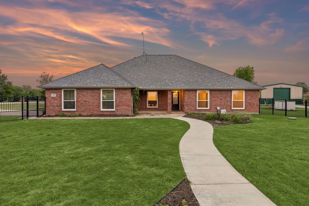 1901 Saw Tooth Court Haslet, TX 76052 - Photo 6 of 38 a front view of a house with a garden