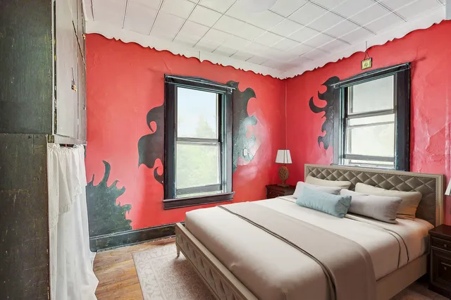 a bedroom with a bed and window