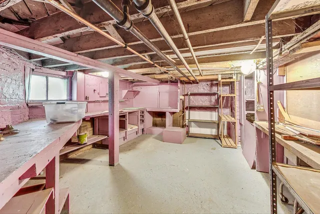 a view of a room with wooden furniture