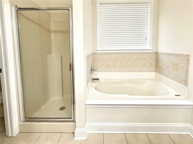 a bathroom with a bath tub