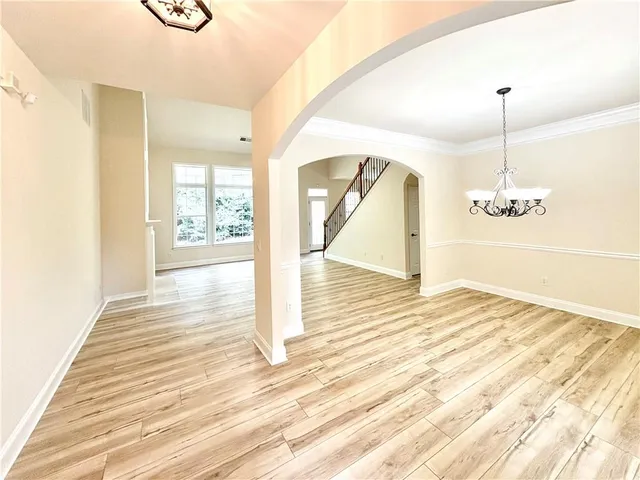 a view of a room & wooden floor