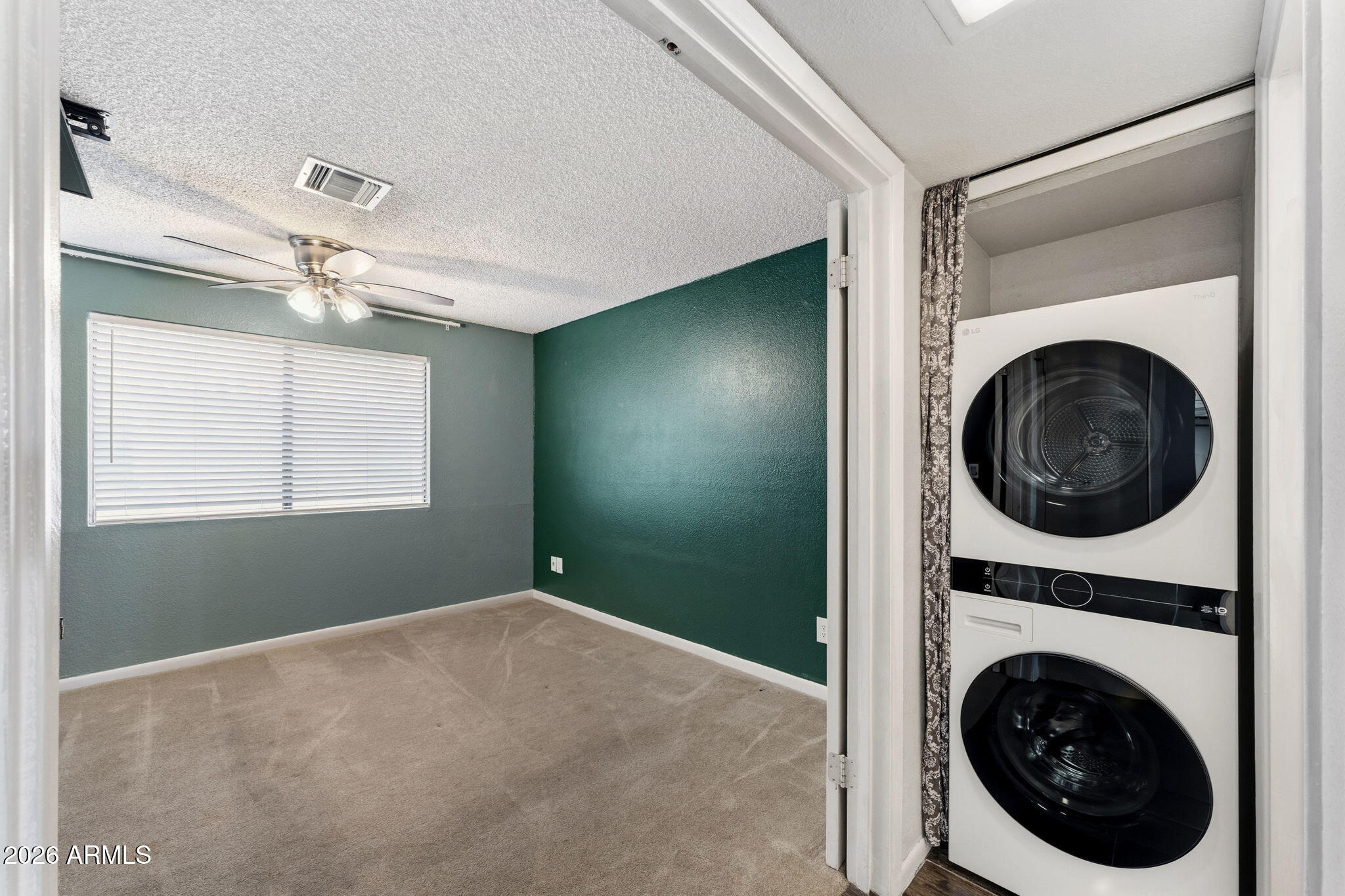 30 East Brown Road, Unit 2070 Mesa, AZ 85201 - Photo 14 of 20 a view of a hallway with washer and dryer