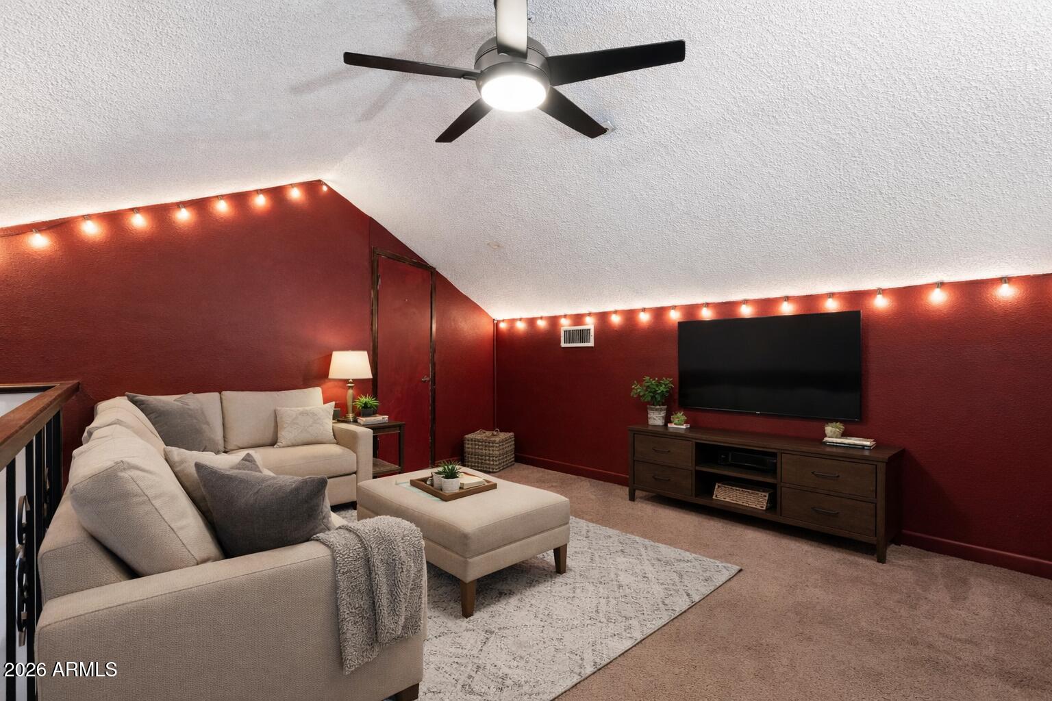 30 East Brown Road, Unit 2070 Mesa, AZ 85201 - Photo 16 of 20 a living room with furniture and a flat screen tv