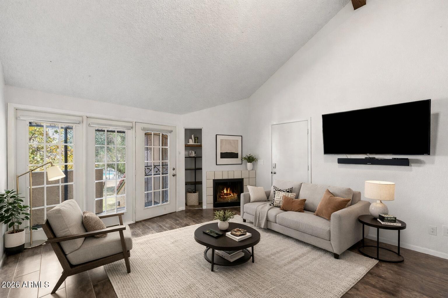 30 East Brown Road, Unit 2070 Mesa, AZ 85201 - Photo 20 of 20 a living room with furniture a flat screen tv and a fireplace