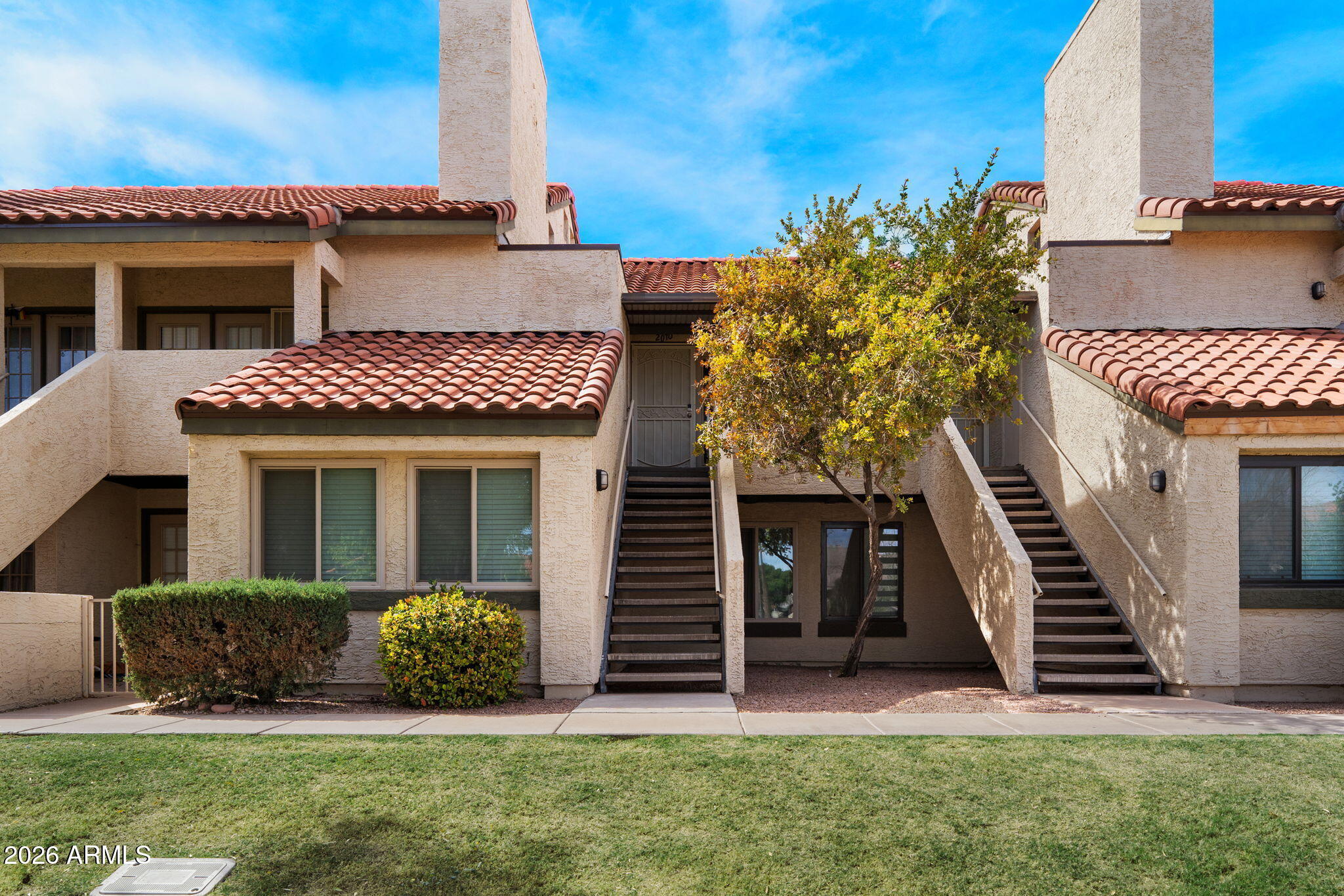 30 East Brown Road, Unit 2070 Mesa, AZ 85201 - Photo 2 of 20 a view of a house with a yard and stairs