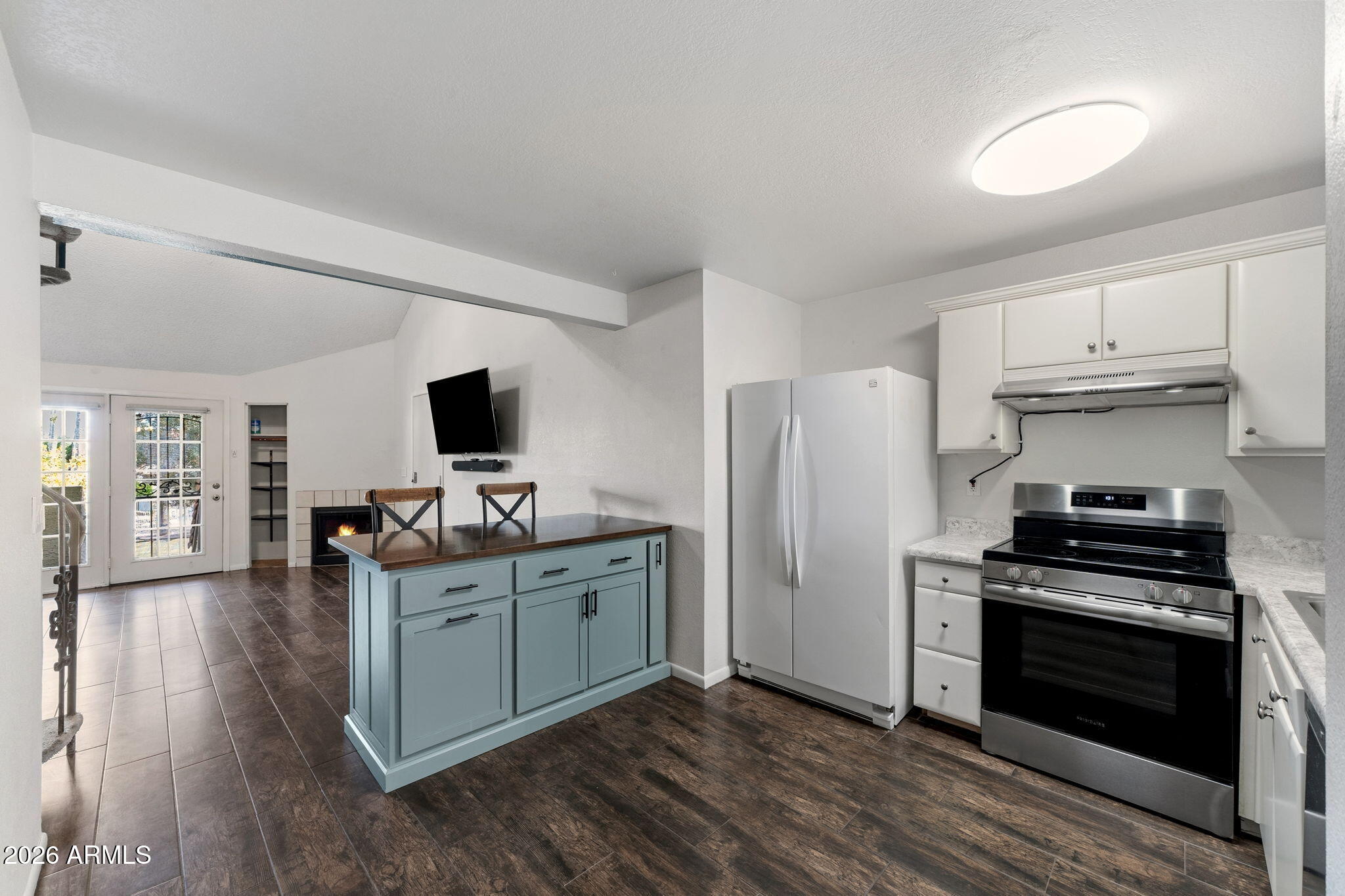30 East Brown Road, Unit 2070 Mesa, AZ 85201 - Photo 6 of 20 a kitchen with cabinets and wooden floor