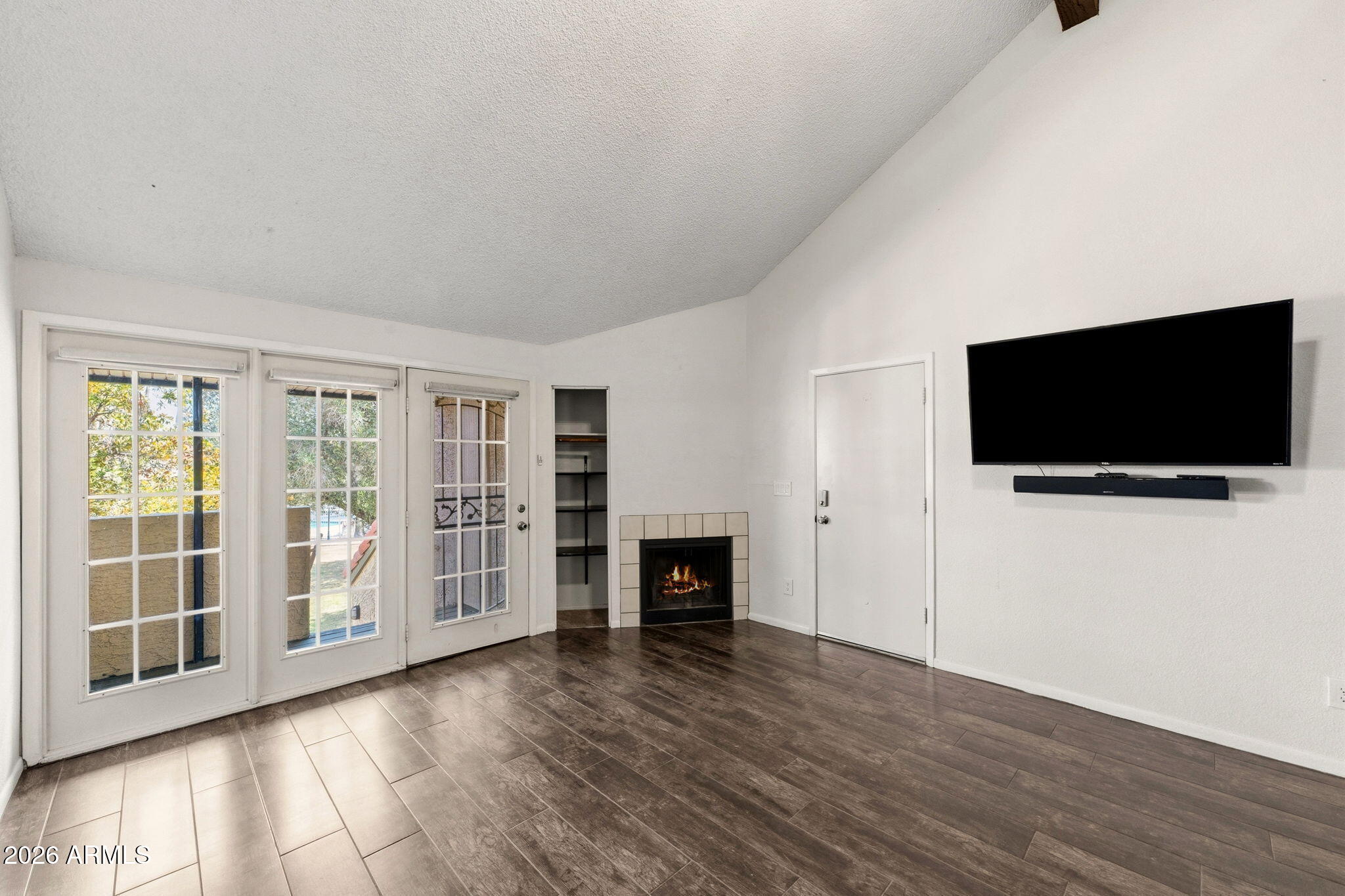 30 East Brown Road, Unit 2070 Mesa, AZ 85201 - Photo 8 of 20 a view of a livingroom with wooden floor and a flat screen tv