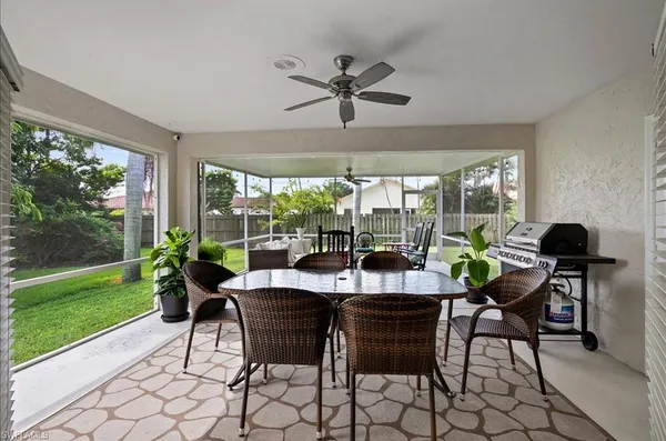 a dining room with furniture and window
