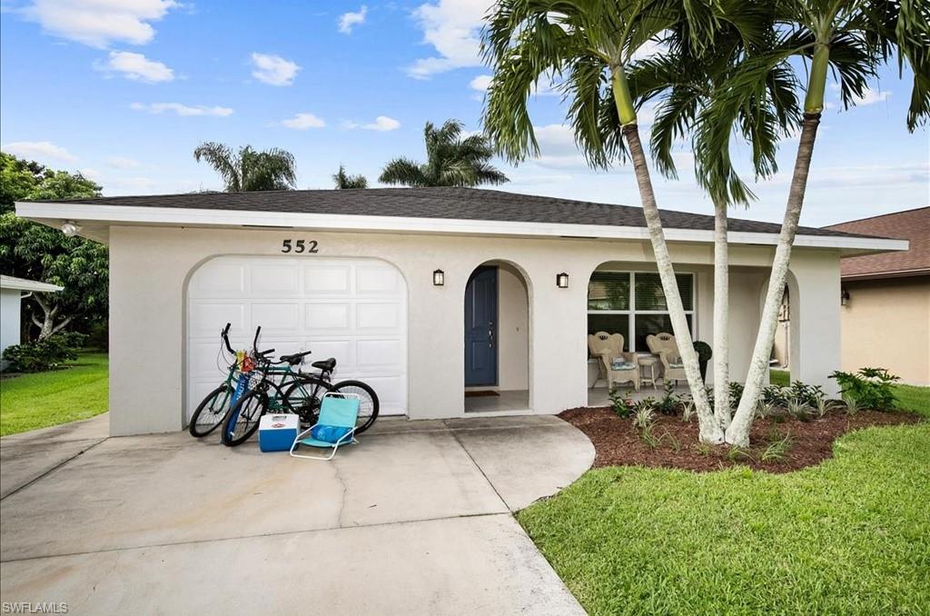 552 105th Avenue North Naples, FL 34108 - Photo 17 of 17 a front view of a house with patio