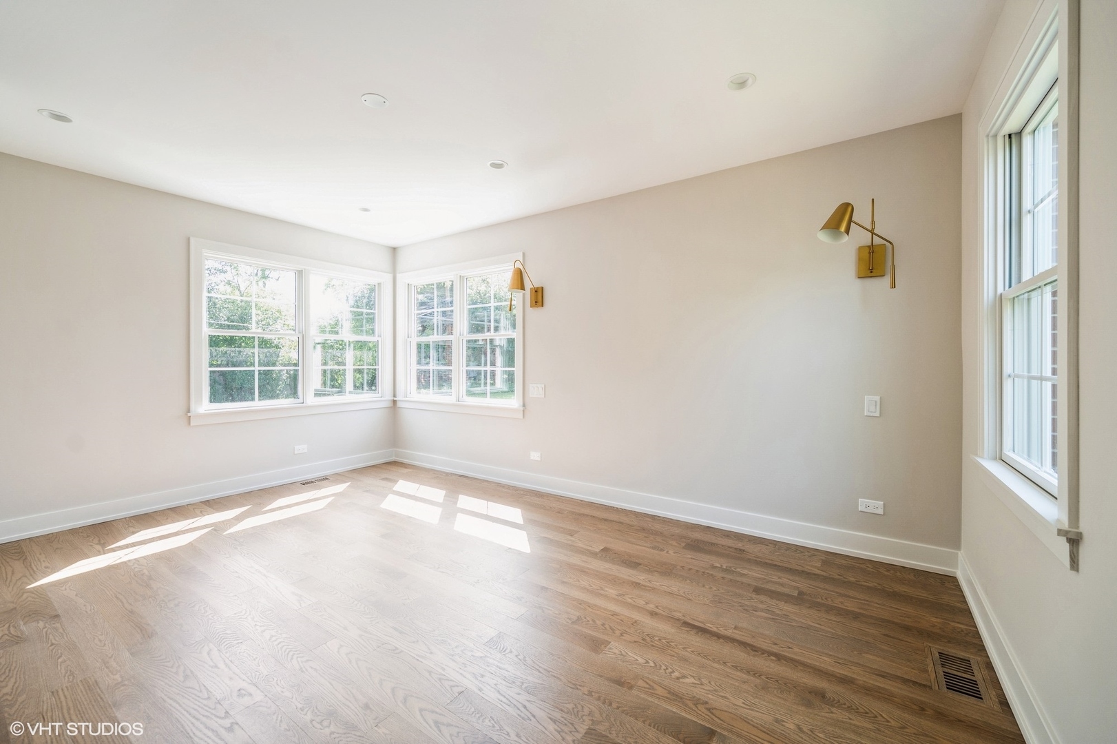 580 North Happ Road Northfield, IL 60093 - Photo 8 of 20 wooden floor in an empty room with a window