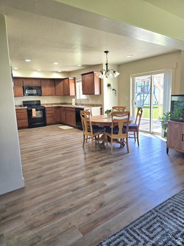 601 West 150 North, Unit 25 Springville, UT 84663 - Photo 9 of 29 Spacious kitchen and dining area featuring wood-finish flooring throughout