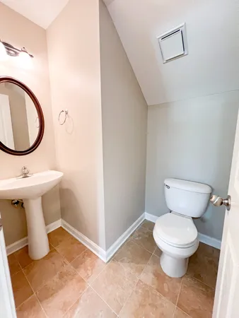 a bathroom with a toilet and a sink