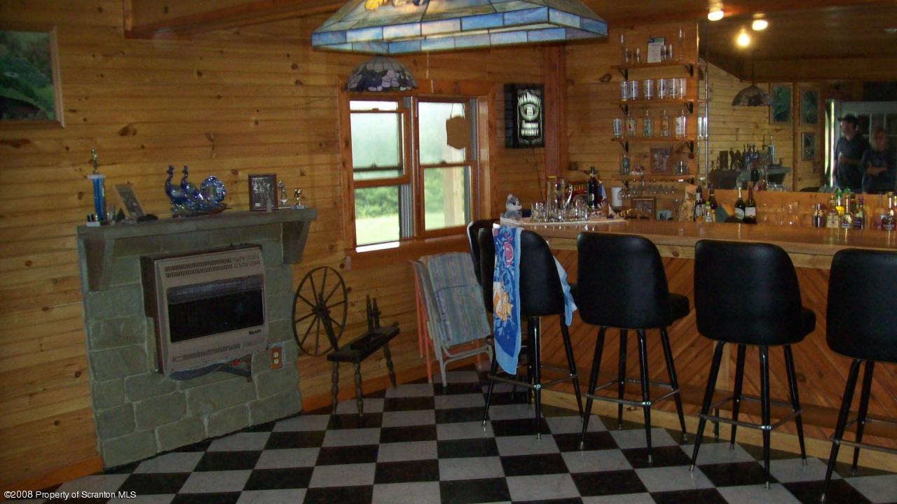 198 D Murray Road Meshoppen, PA 18630 - Photo 5 of 13 a dining room with furniture and a fireplace