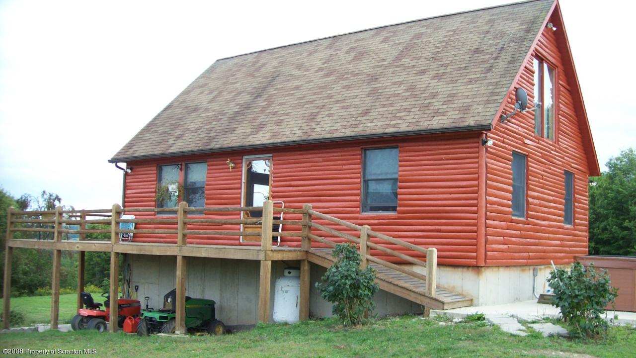 198 D Murray Road Meshoppen, PA 18630 - Photo 8 of 13 a front view of a house with a garden and plants
