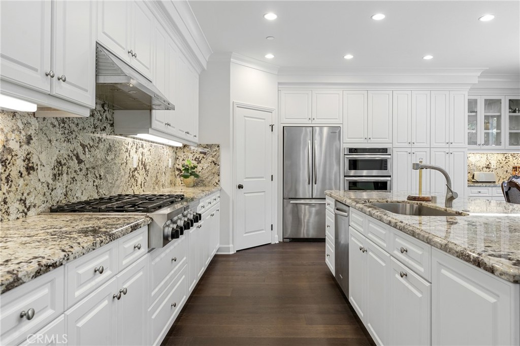 45 Triana Irvine, CA 92618 - Photo 15 of 39 a kitchen with stainless steel appliances granite countertop a stove a sink and a refrigerator