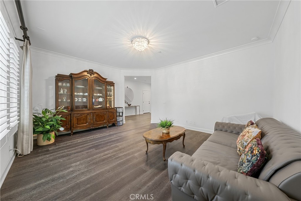 45 Triana Irvine, CA 92618 - Photo 19 of 39 a living room with furniture and a chandelier