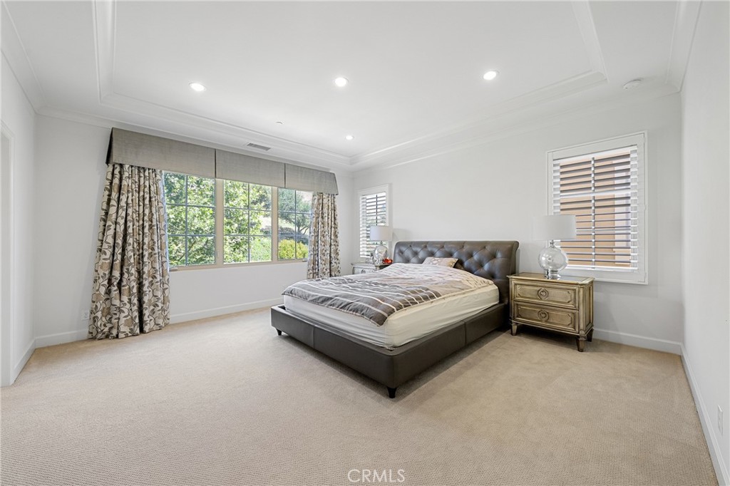45 Triana Irvine, CA 92618 - Photo 21 of 39 a bedroom with a bed and a large window