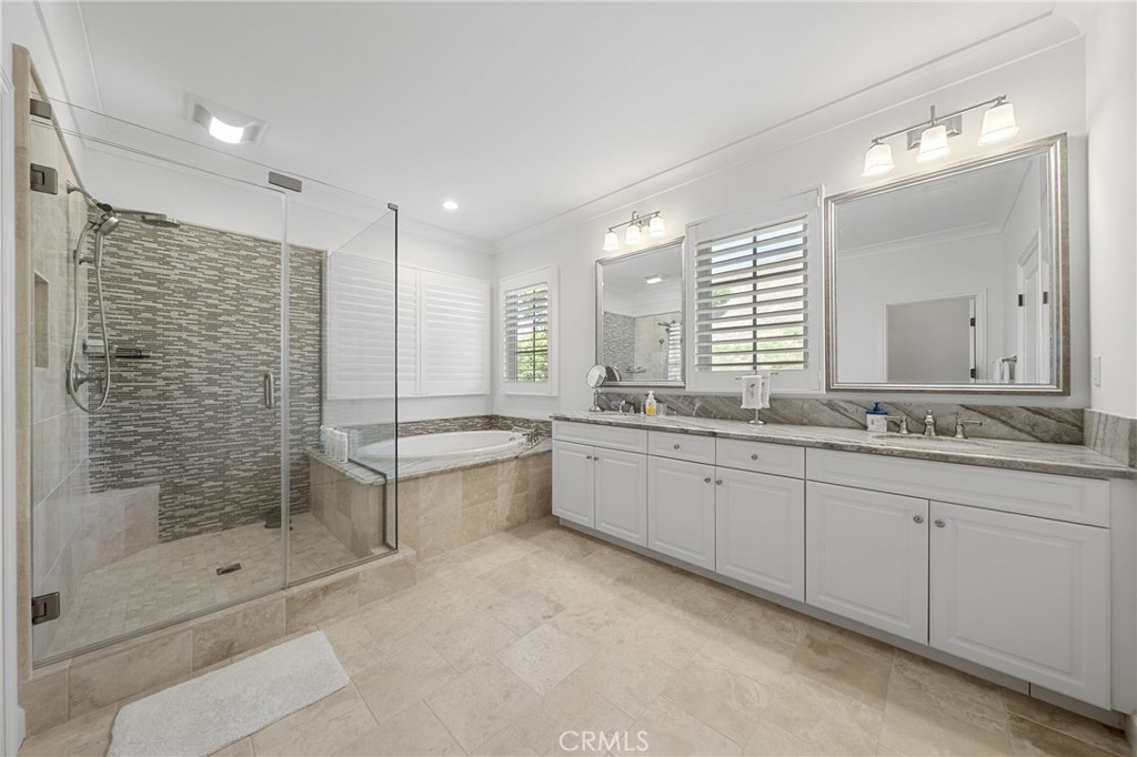 45 Triana Irvine, CA 92618 - Photo 23 of 39 a bathroom with a granite countertop sink mirror and bathtub