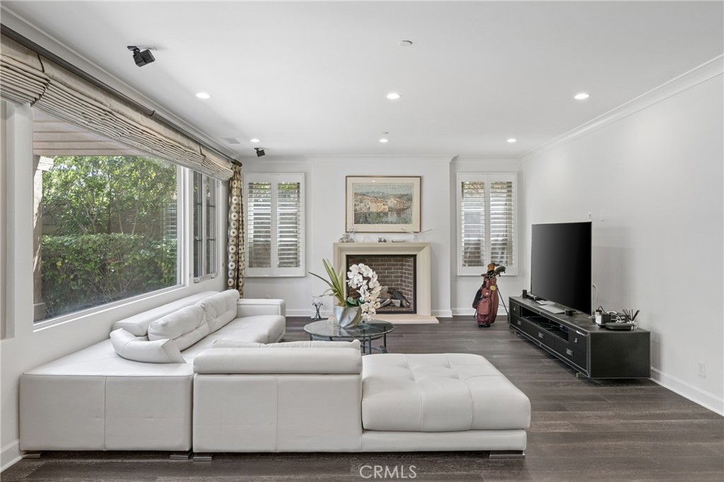 45 Triana Irvine, CA 92618 - Photo 8 of 39 a living room with fireplace furniture and a flat screen tv
