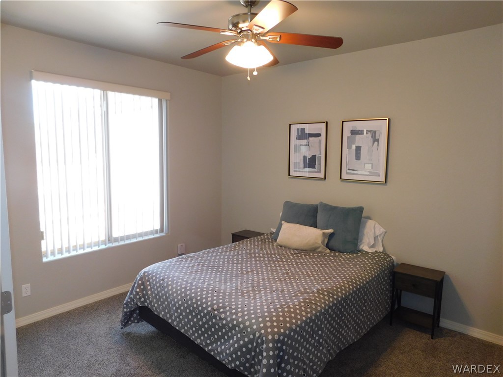 3370 South Ridge Avenue Bullhead City, AZ 86429 - Photo 49 of 56 a bedroom with a large bed and a window
