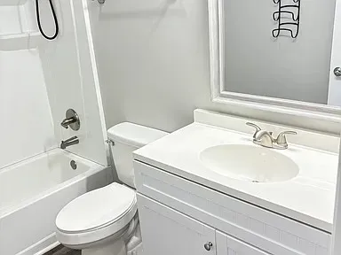 a bathroom with a sink a toilet and a bathtub