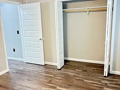 a view of closet area with empty racks