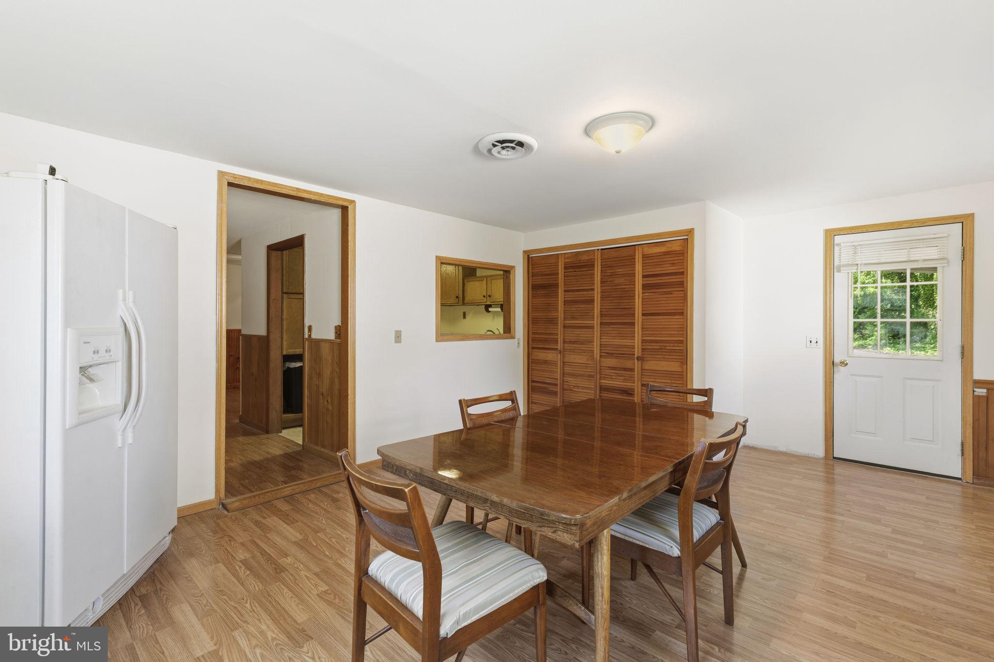 2411 Poplar Road Baltimore, MD 21221 - Photo 20 of 36 a view of a dining room with furniture and wooden floor