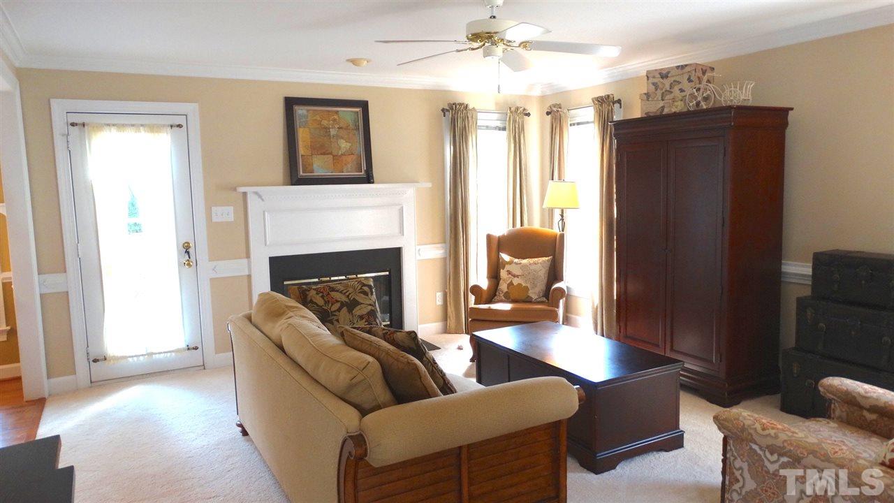 9209 Dawnshire Road Raleigh, NC 27615 - Photo 4 of 25 What a bright, open Family Room! Open to the kitchen and eating area, a NEW gas fireplace, bright windows, chair rail, and a ceiling fan, this room has it all!