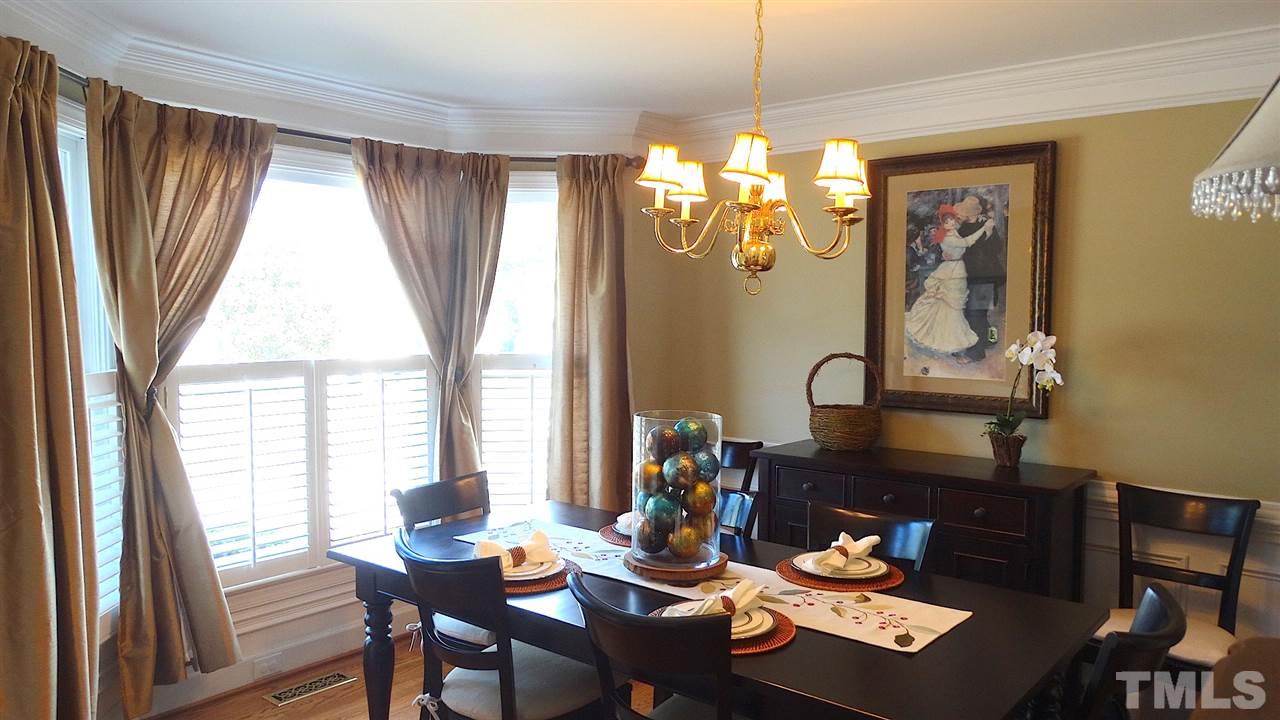 9209 Dawnshire Road Raleigh, NC 27615 - Photo 6 of 25 Bow Windows, Crown Moldings, Chandelier, Hardwood Floors, Wainscoting, and Plantation Shutters!