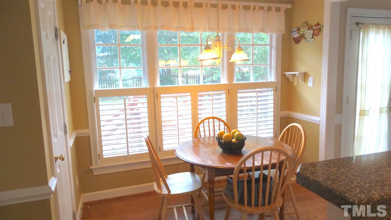 9209 Dawnshire Road Raleigh, NC 27615 - Photo 10 of 25 Cheerful and Bright, this Breakfast Area will be a great place to start your day! Open the Plantation Shutters and let the sunshine in!