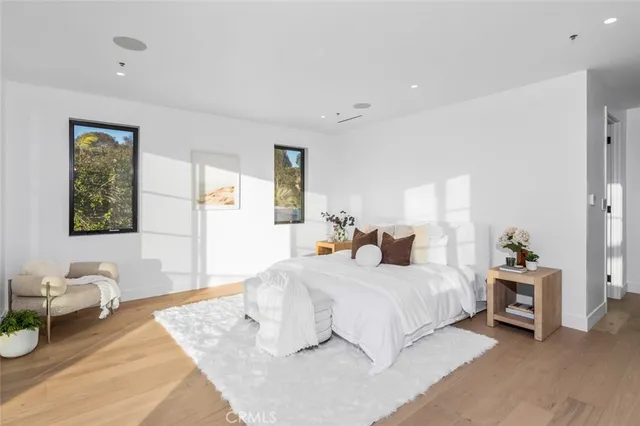 a bedroom with a bed and a couch