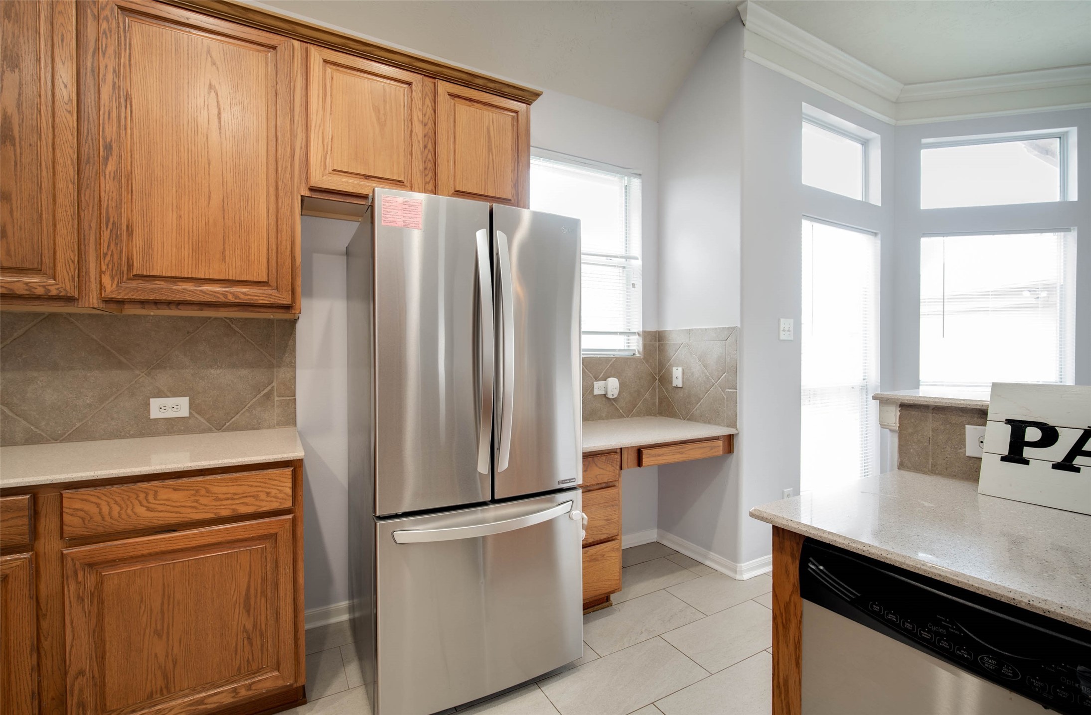 9323 Hillhaven Court Rosenberg, TX 77469 - Photo 13 of 37 a kitchen with stainless steel appliances a refrigerator and a sink