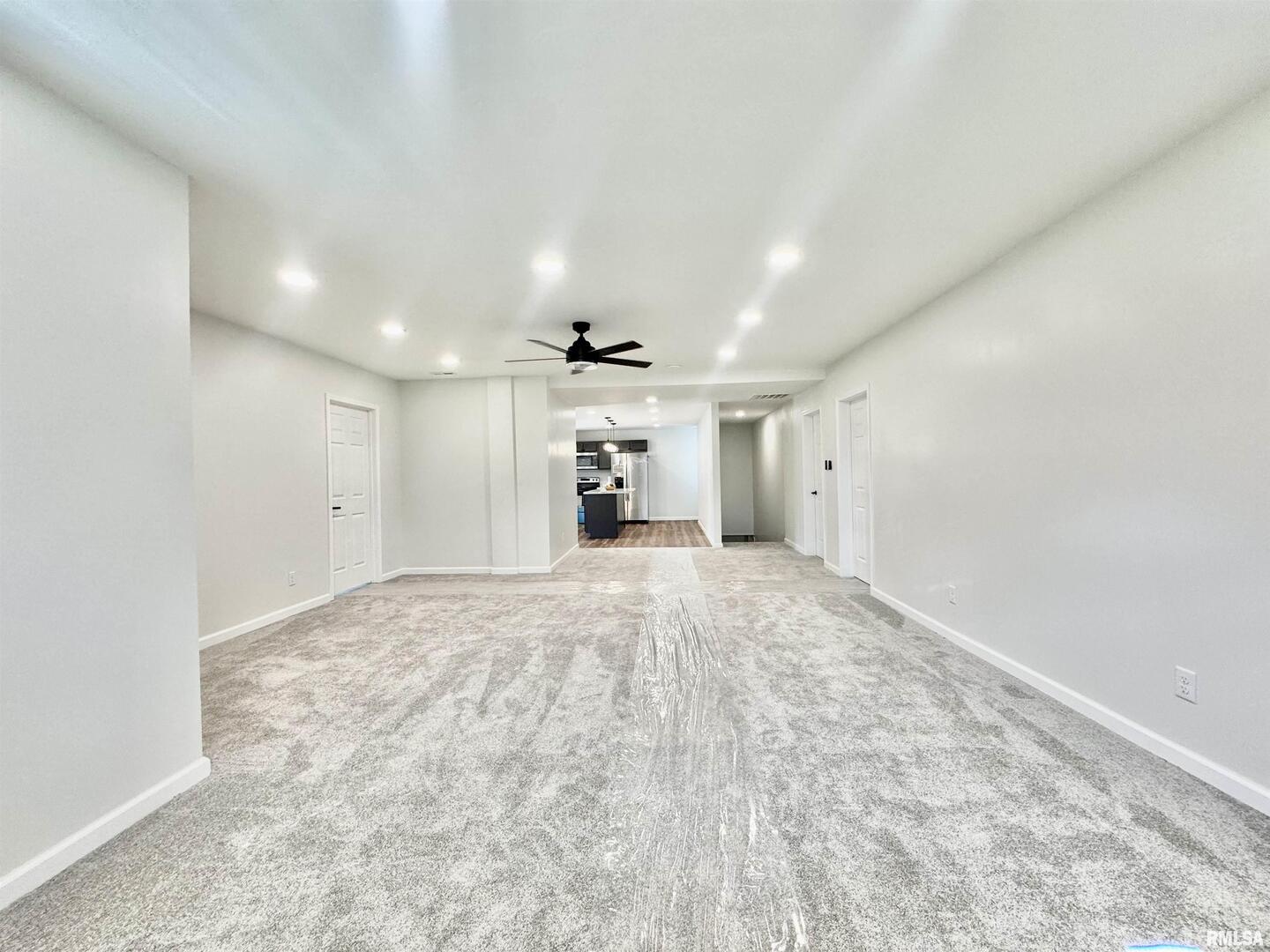 309 West Main Street Ewing, IL 62836 - Photo 16 of 37 a view of empty room with a kitchen