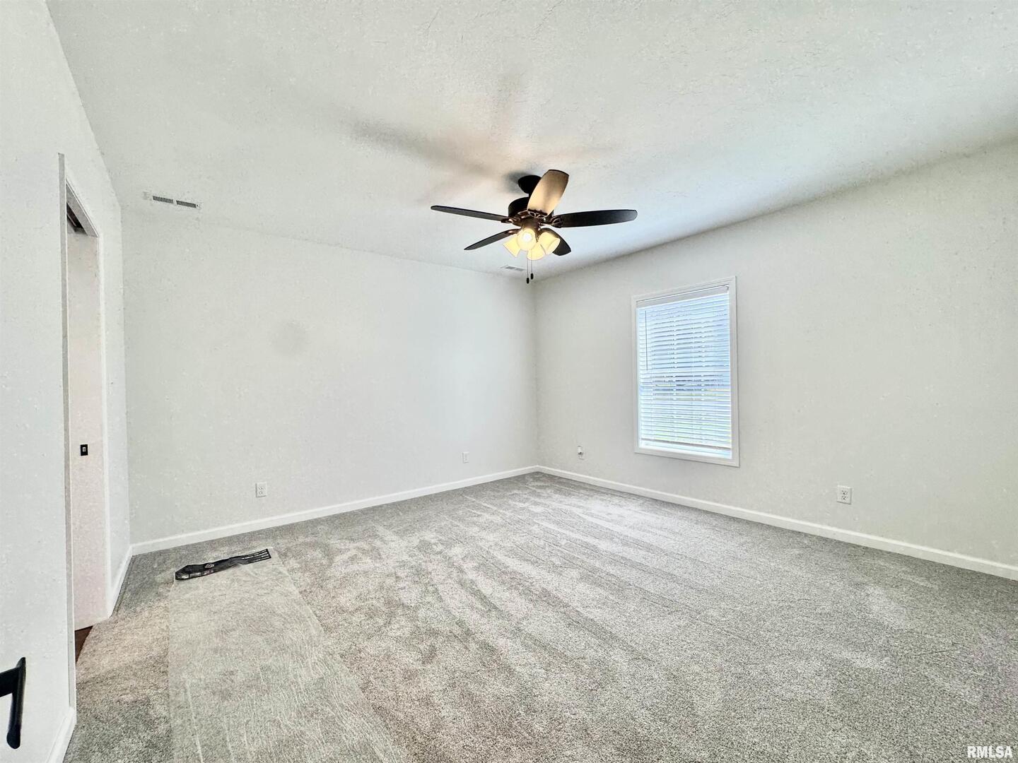 309 West Main Street Ewing, IL 62836 - Photo 17 of 37 a view of an empty room with a window