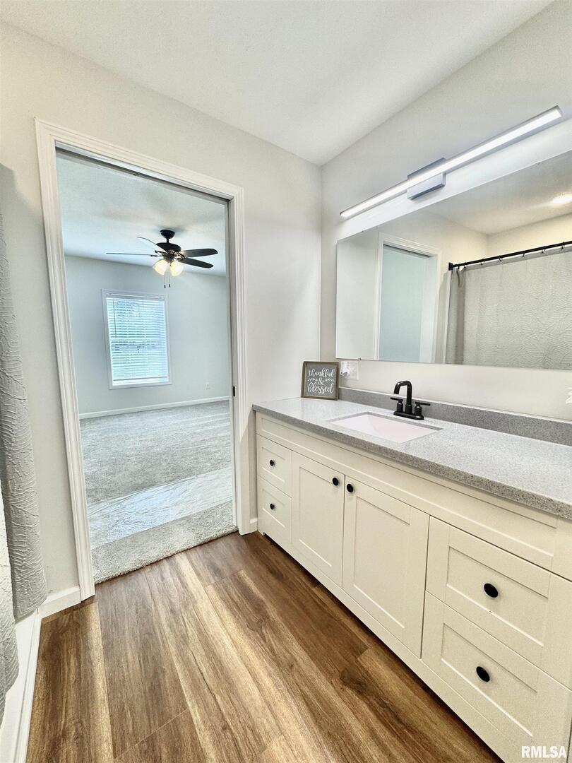 309 West Main Street Ewing, IL 62836 - Photo 19 of 37 a spacious bathroom with double vanity and a mirror