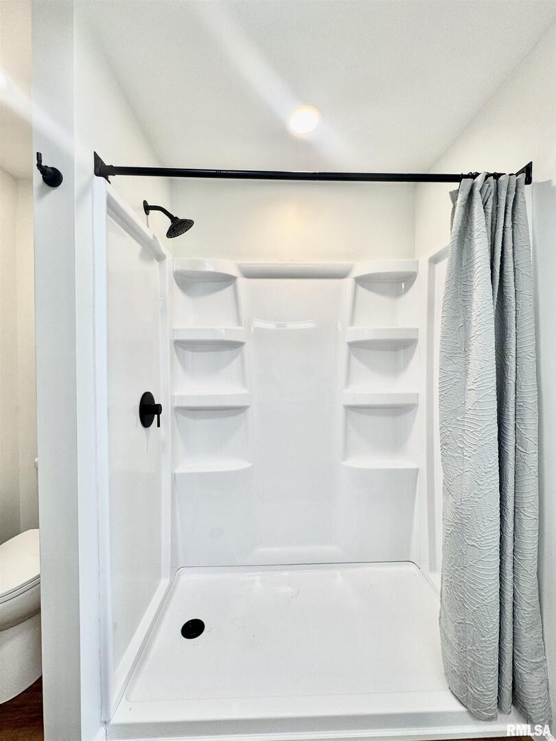309 West Main Street Ewing, IL 62836 - Photo 20 of 37 a bathroom with a shower and a bath tub