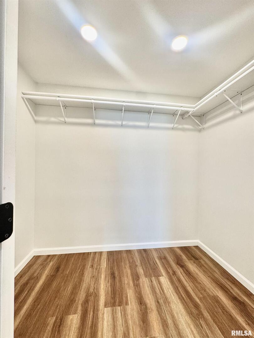 309 West Main Street Ewing, IL 62836 - Photo 21 of 37 a view of a room with wooden floor and closet