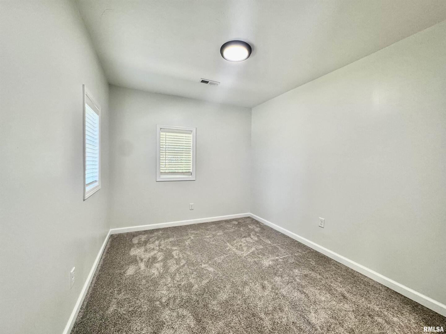 309 West Main Street Ewing, IL 62836 - Photo 26 of 37 an empty room with a window