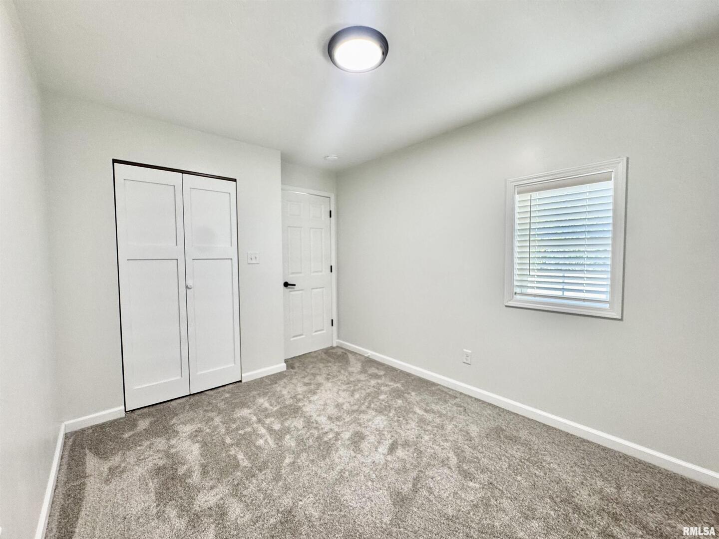 309 West Main Street Ewing, IL 62836 - Photo 27 of 37 an empty room with a window