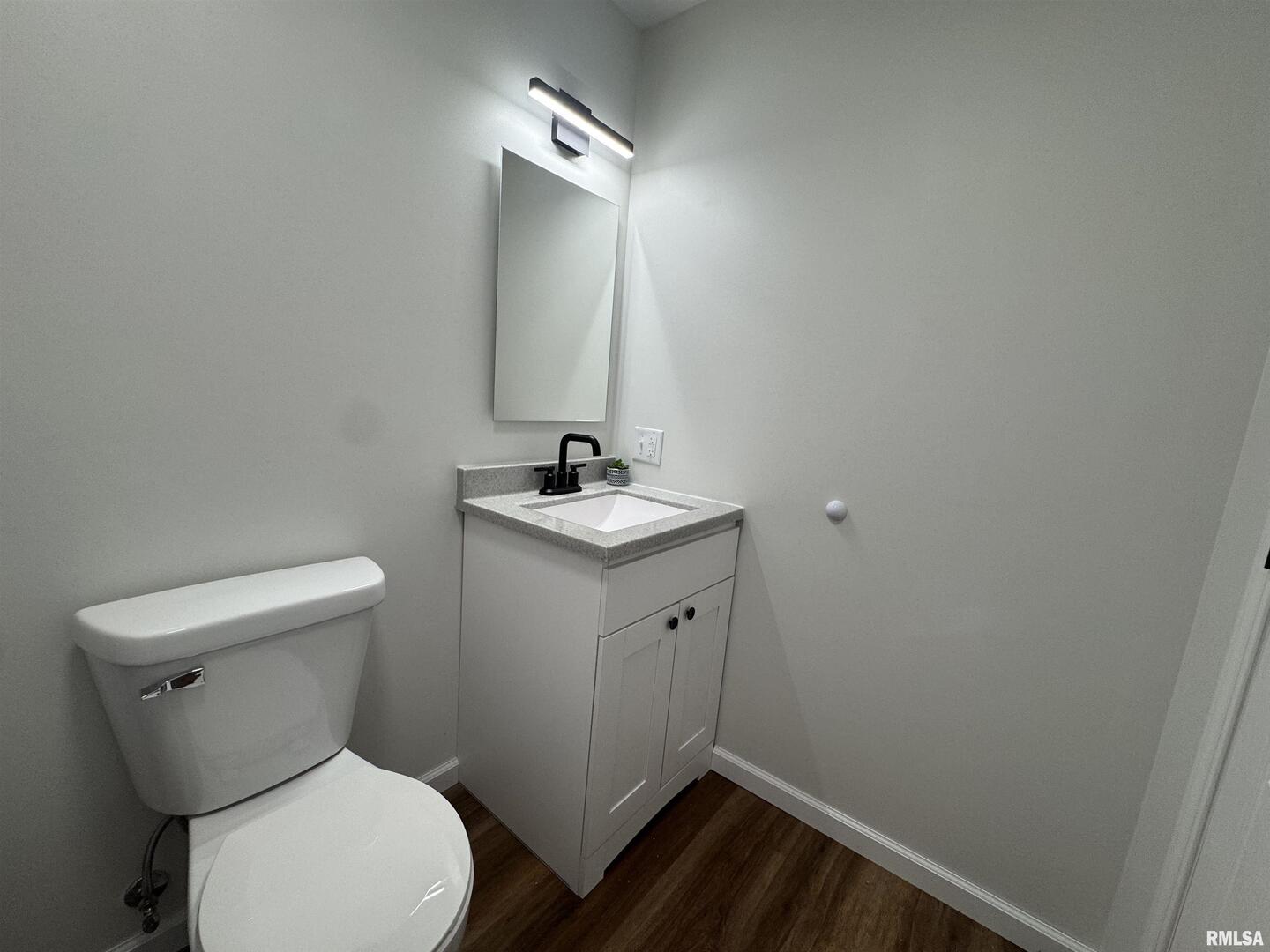 309 West Main Street Ewing, IL 62836 - Photo 29 of 37 a bathroom with a toilet sink and mirror
