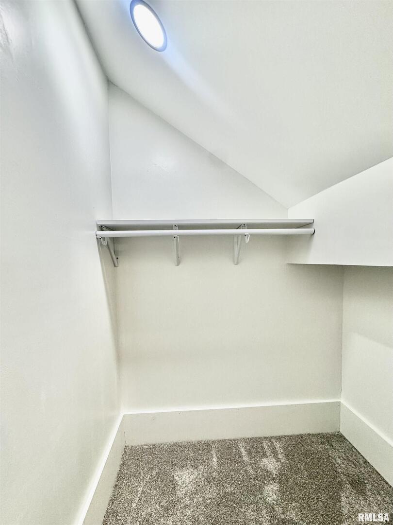 309 West Main Street Ewing, IL 62836 - Photo 35 of 37 a view of walk in closet with empty racks