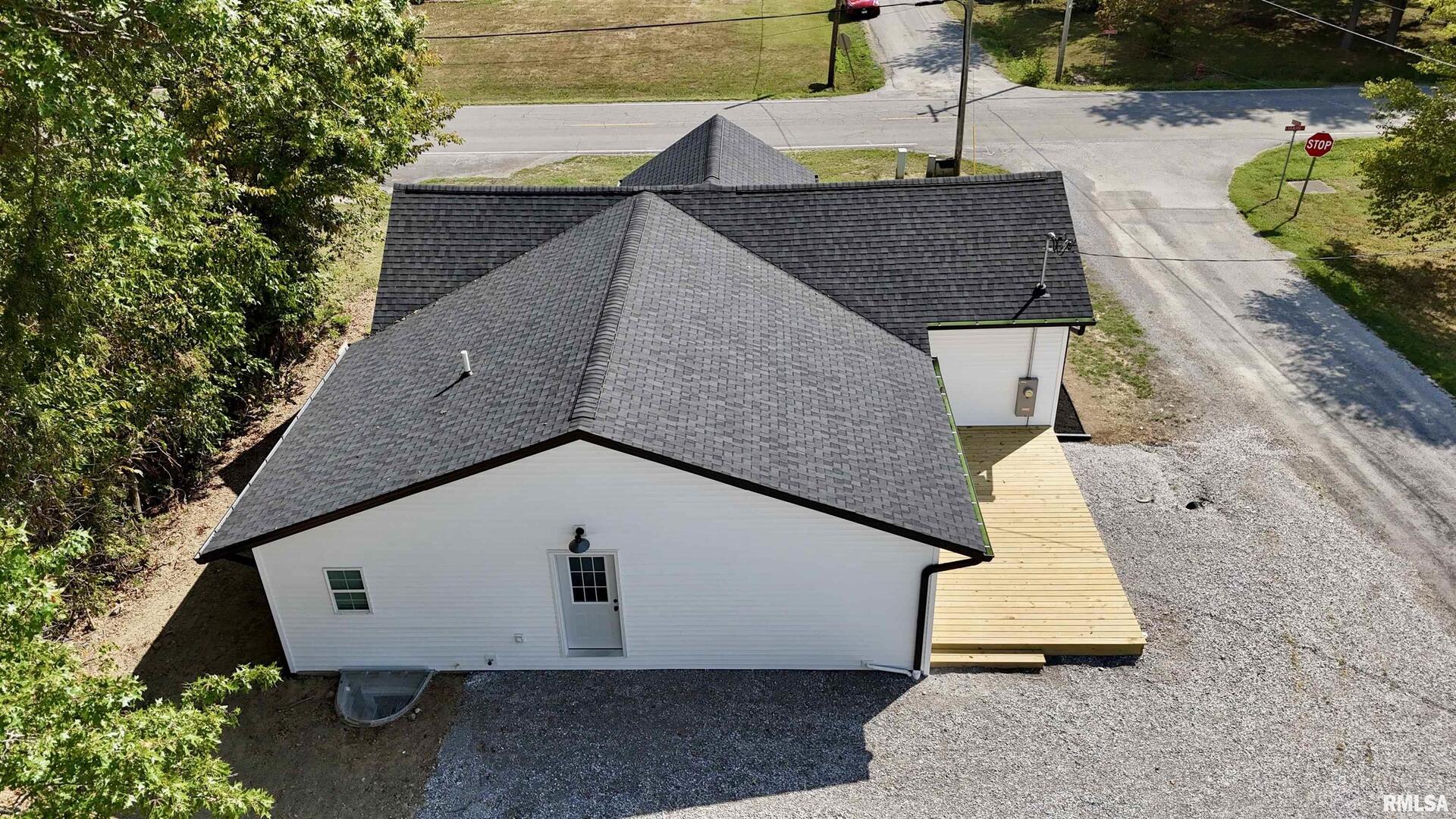 309 West Main Street Ewing, IL 62836 - Photo 5 of 37 an aerial view of a house with garden