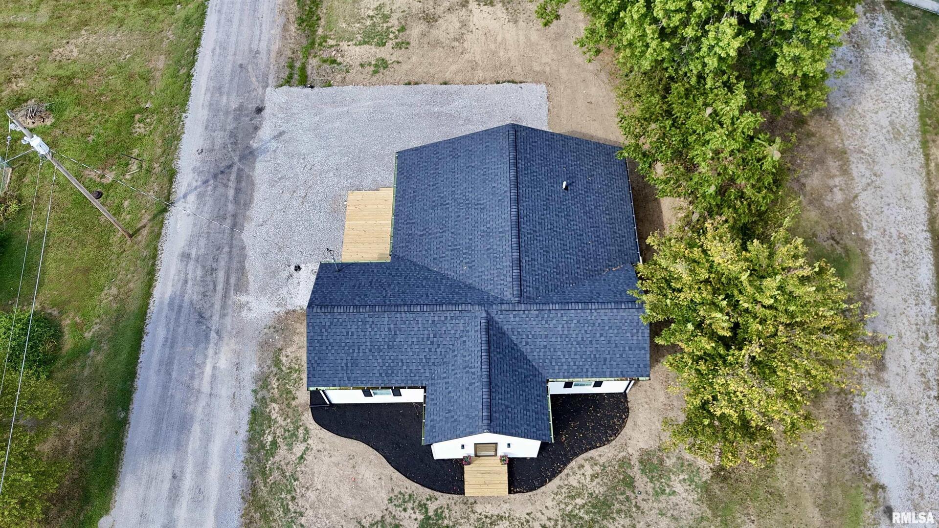 309 West Main Street Ewing, IL 62836 - Photo 6 of 37 an aerial view of a house with garden space and street view
