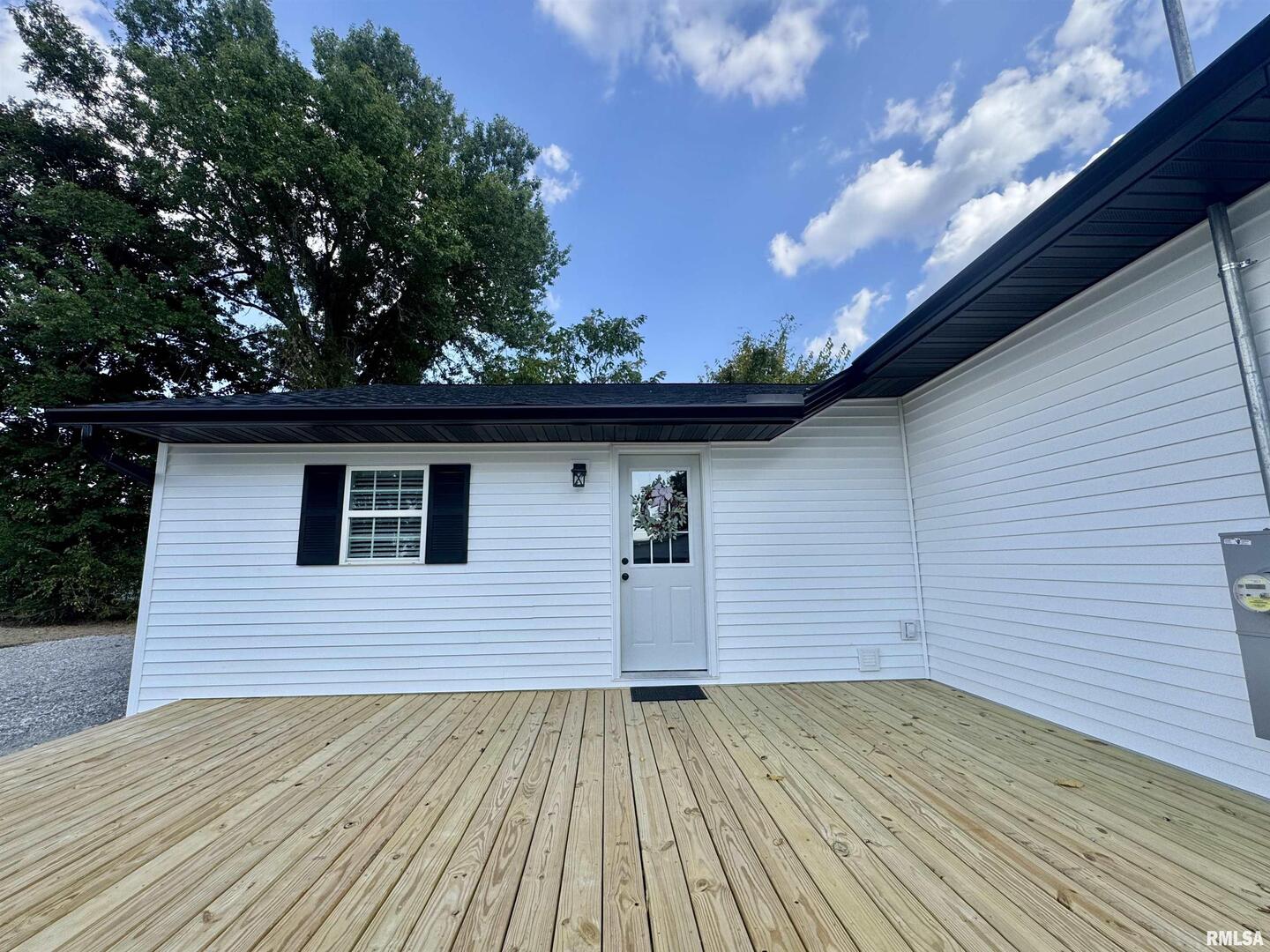 309 West Main Street Ewing, IL 62836 - Photo 8 of 37 a view of a house with a wooden deck