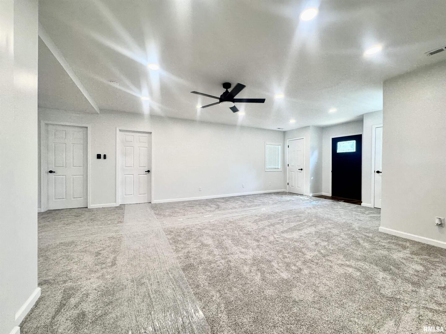 309 West Main Street Ewing, IL 62836 - Photo 9 of 37 an empty room with closet and windows