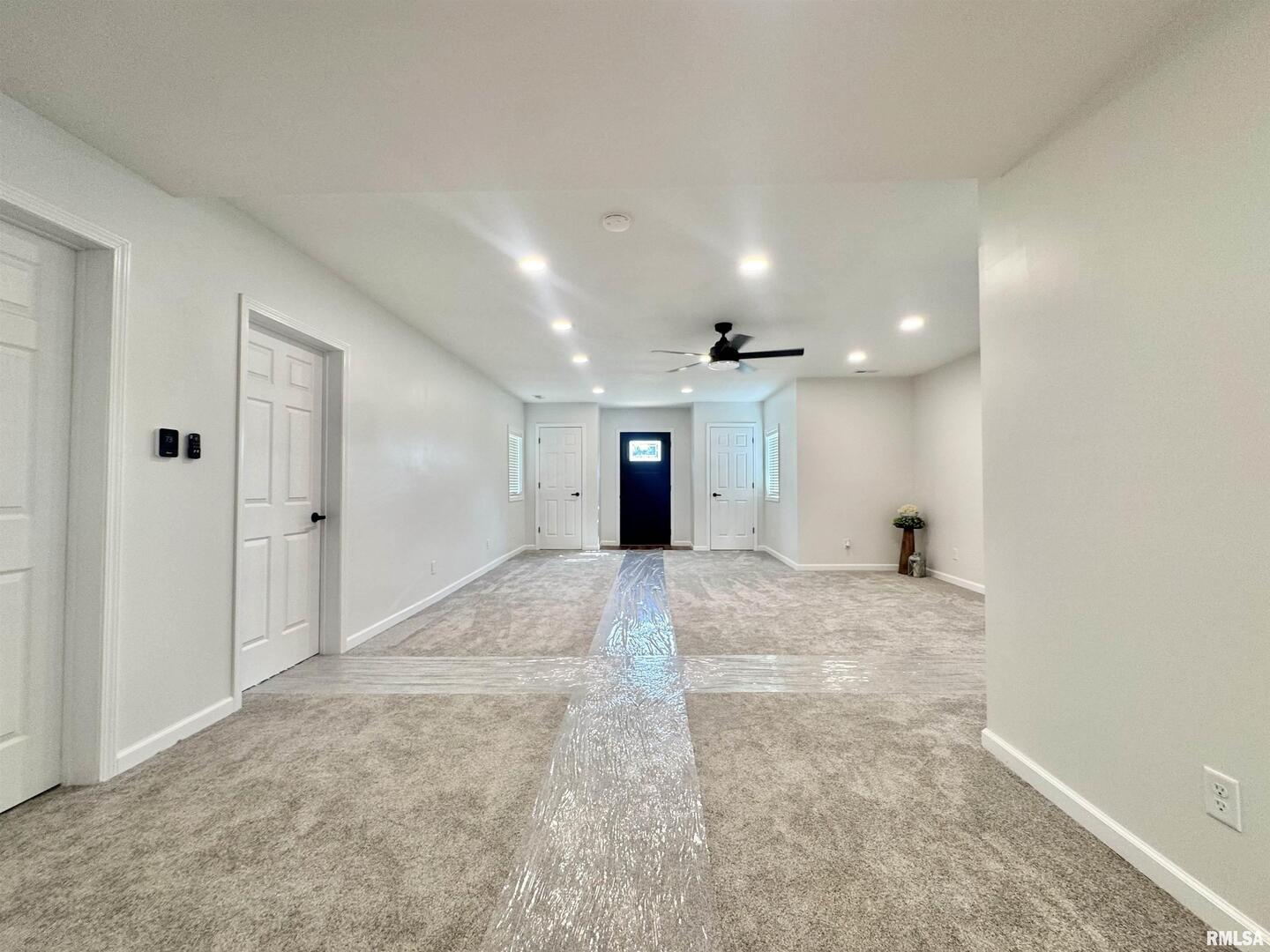 309 West Main Street Ewing, IL 62836 - Photo 10 of 37 a view of a hallway with wooden shelves