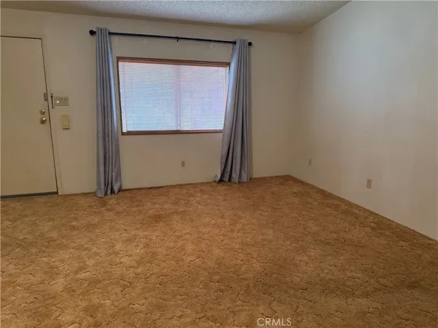 an empty room with closet area